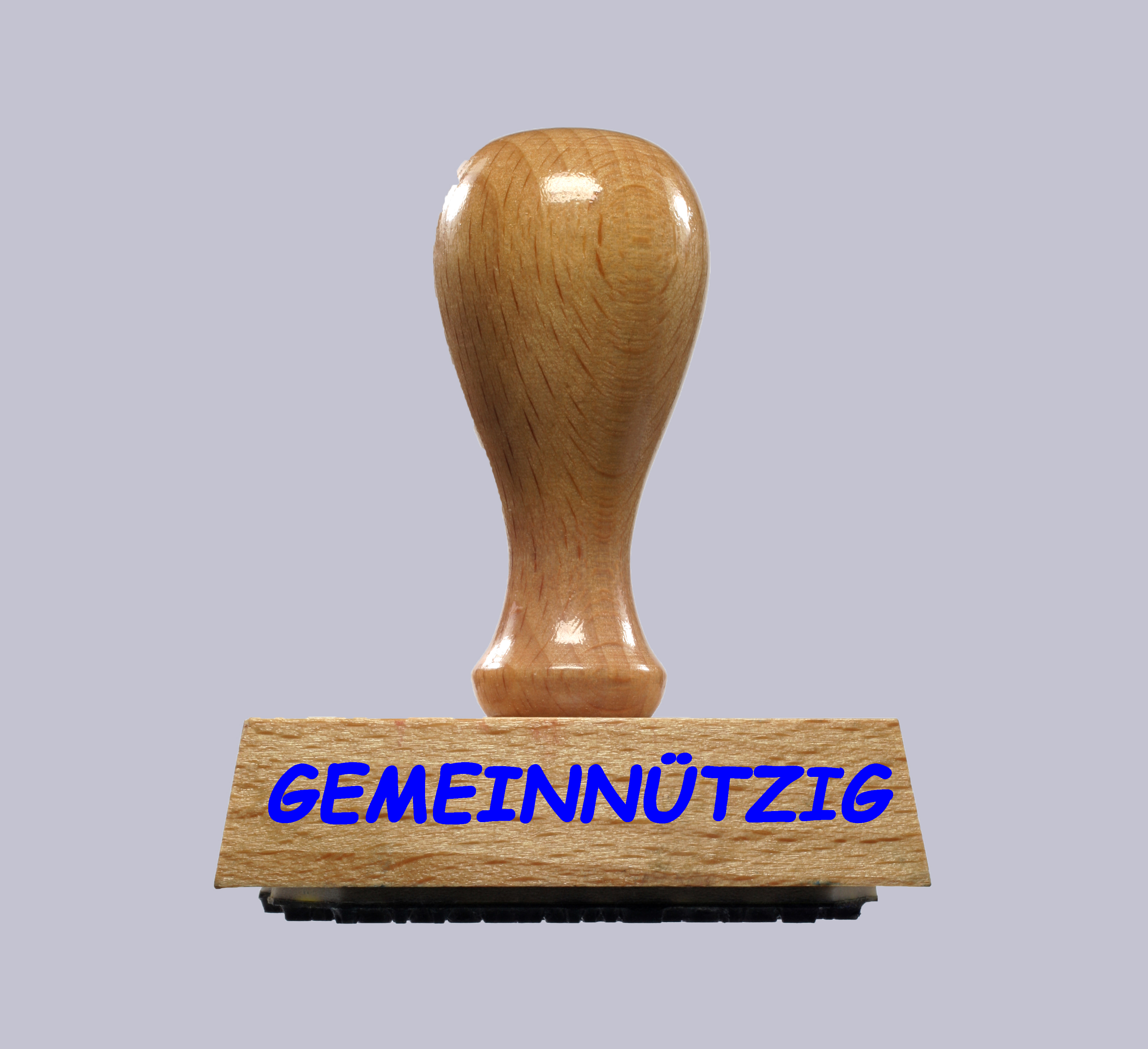 Das Bild zeigt einen Stempel aus Holz mit der Aufschrift Gemeinnützigkeit.